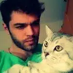 Furkan Andic with white cat