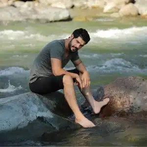 Tolga Mendi in river